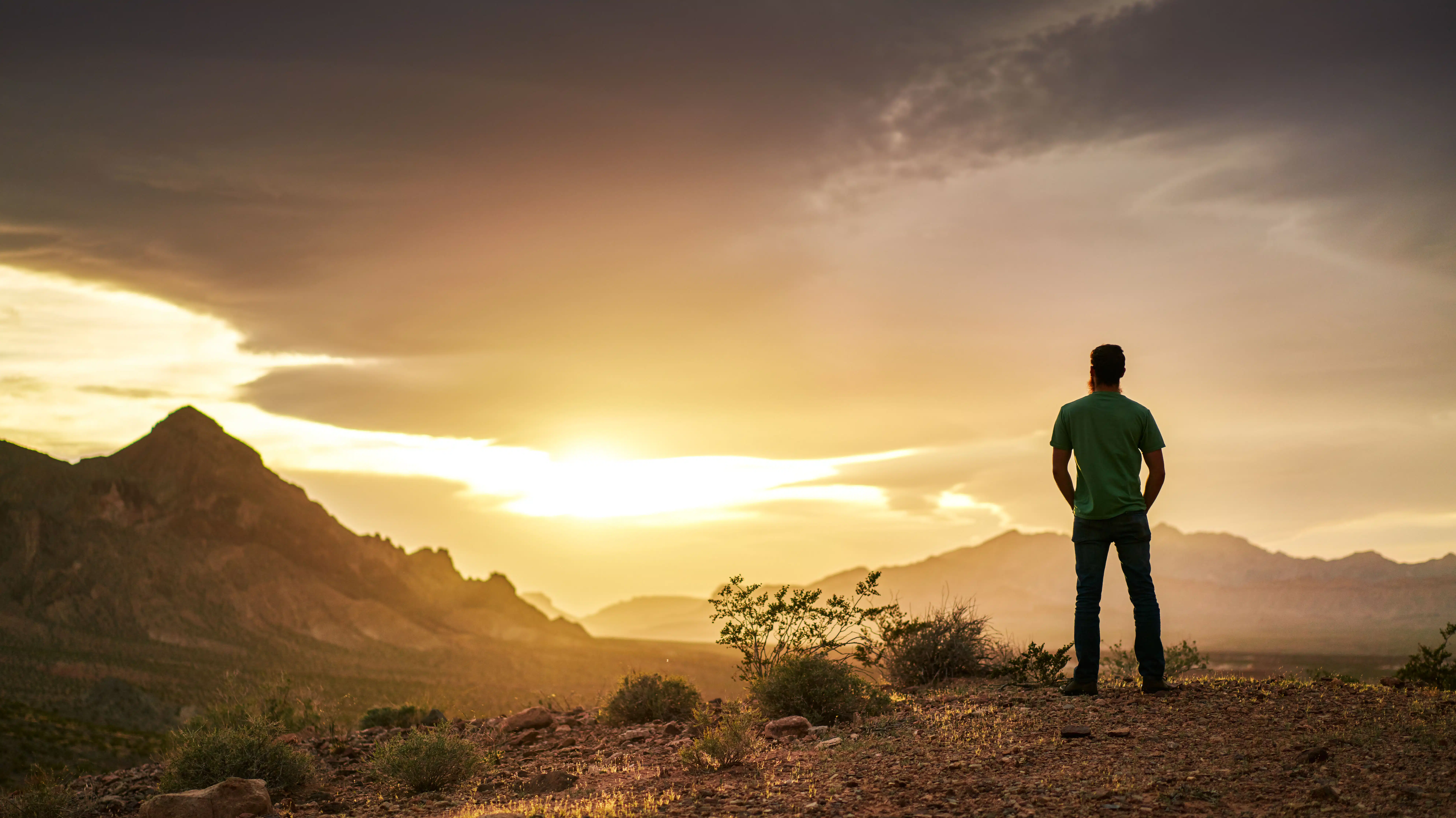 A man watches the sun set - 10 Tips On Rebuilding Your Life After Addiction