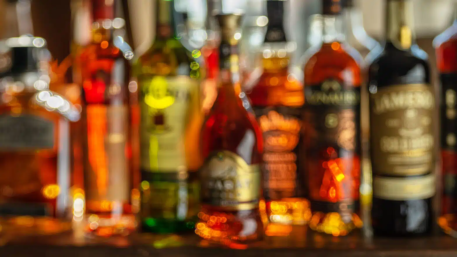 A blurred image of multiple liquor bottles - Am I Drinking Too Much