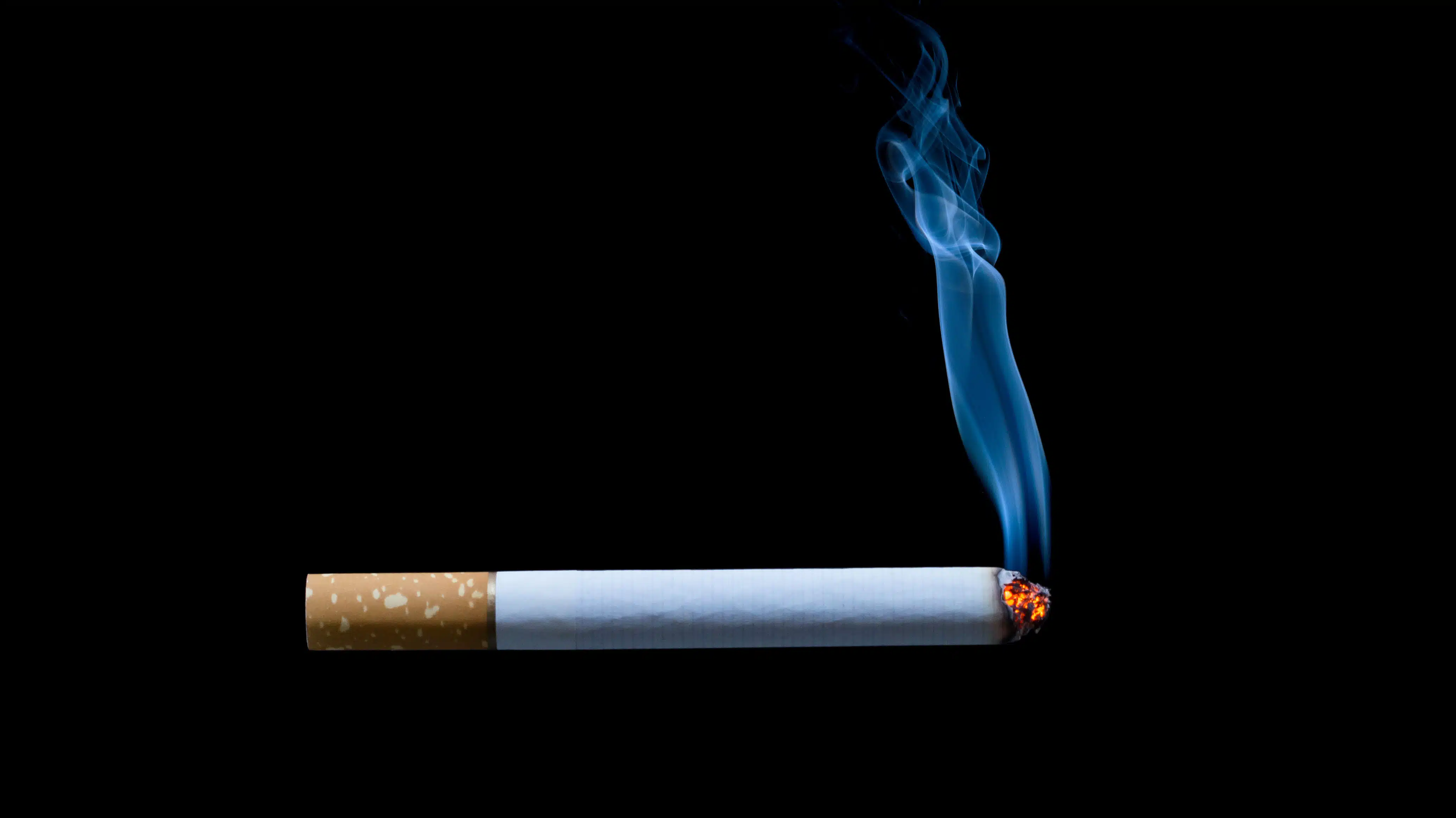 A cigarette with smoke coming off of it - What Are Wet Drugs Risks Of Smoking A Wet Cigarette